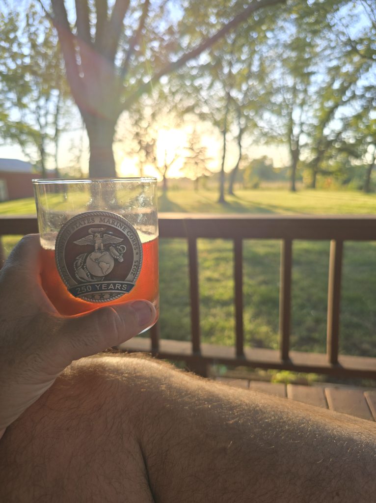 A drink on the farmhouse porch at sunset